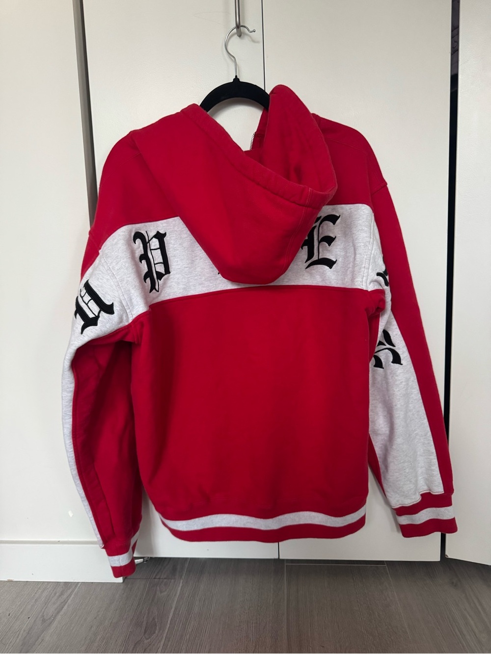 Supreme Red and White Zip-Up Hoodie with Gothic Script